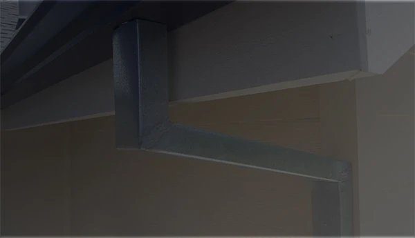 Custom downspout installation on Reno residential home